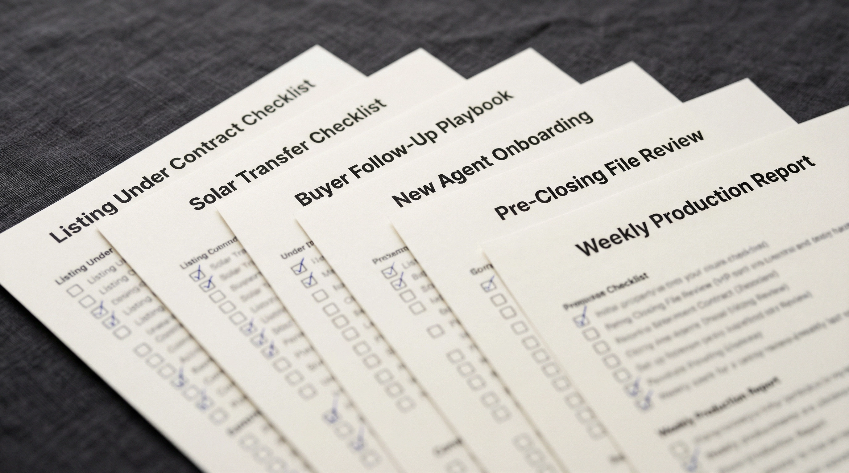 Real estate team checklists and playbooks spread across a desk